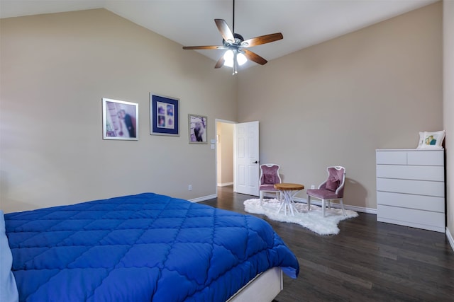 bedroom with ceiling fan, dark hardwood / wood-style flooring, and lofted ceiling