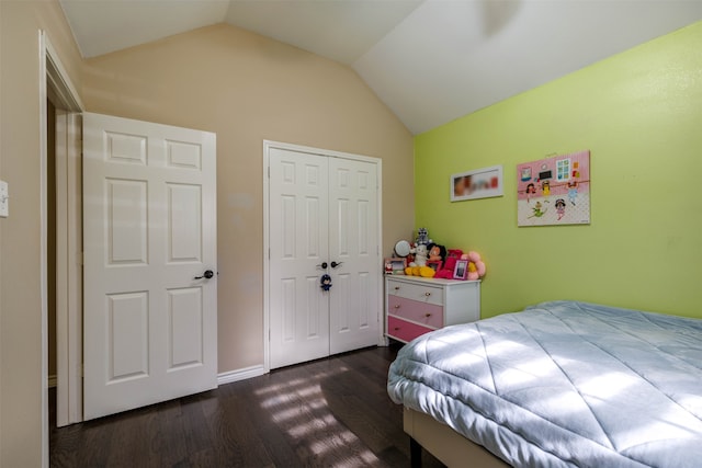 bedroom featuring vaulted ceiling, a closet, and dark hardwood / wood-style floors