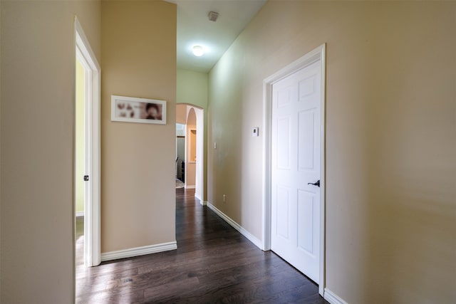 hallway featuring dark hardwood / wood-style flooring