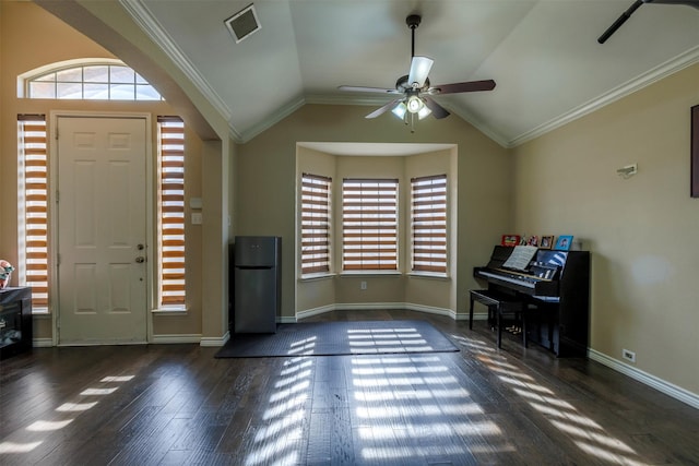 entrance foyer with ceiling fan, crown molding, dark hardwood / wood-style floors, and lofted ceiling