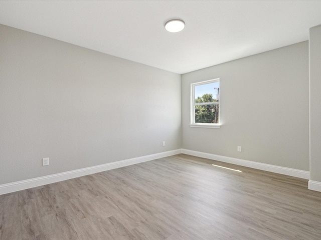 spare room featuring light hardwood / wood-style flooring