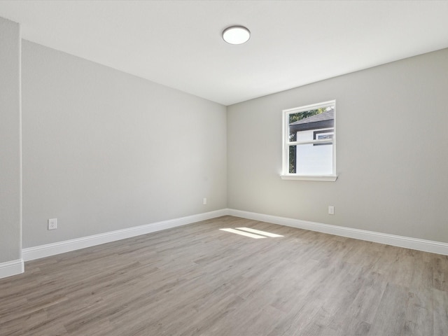 spare room featuring light wood-type flooring