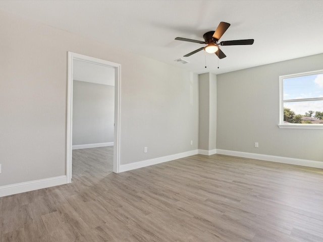 spare room featuring ceiling fan and light wood-type flooring