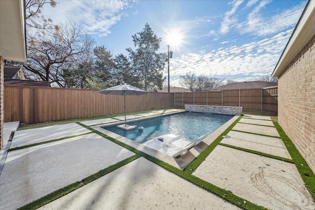 view of swimming pool featuring a patio area