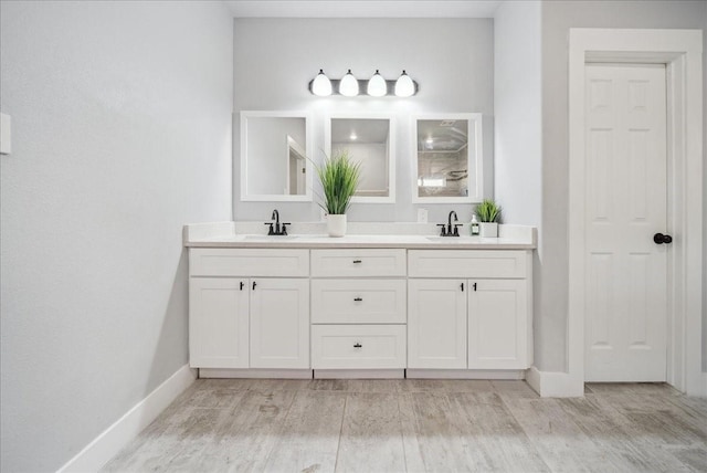 bathroom featuring hardwood / wood-style floors and vanity