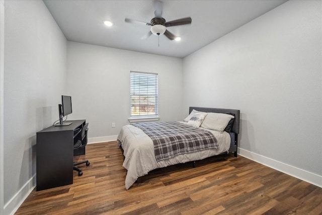 bedroom with ceiling fan and dark hardwood / wood-style flooring