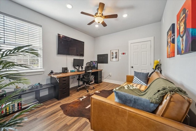 office space with hardwood / wood-style flooring and ceiling fan