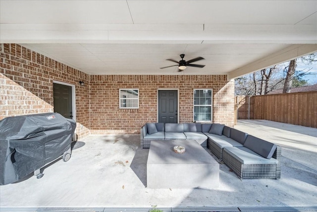 view of patio with an outdoor living space, a grill, and ceiling fan