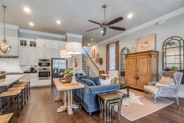 living room with dark hardwood / wood-style floors and ornamental molding