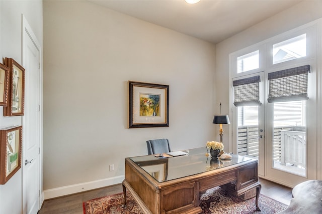 home office with hardwood / wood-style flooring