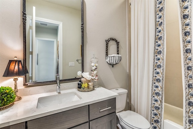 full bathroom featuring vanity, toilet, and shower / bathtub combination with curtain