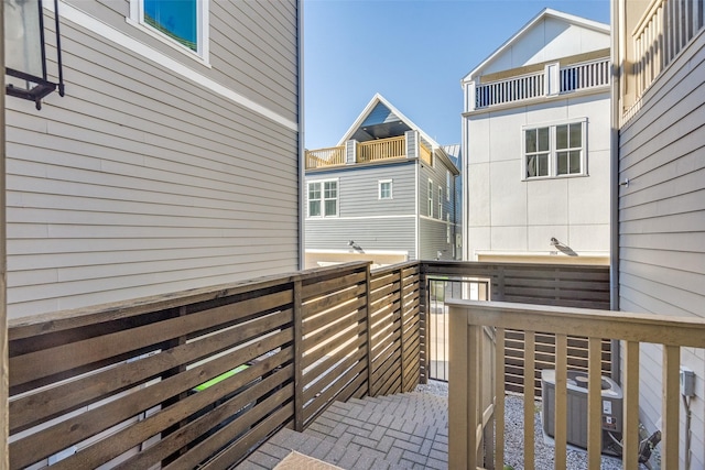 wooden terrace featuring central air condition unit