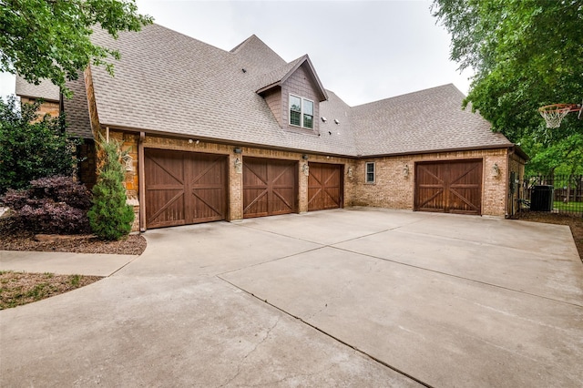 exterior space featuring a garage and central AC unit