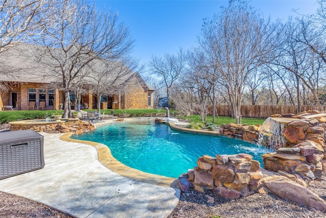 view of pool with a patio and pool water feature