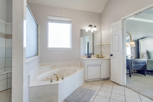 bathroom featuring tile patterned floors, vanity, separate shower and tub, and vaulted ceiling