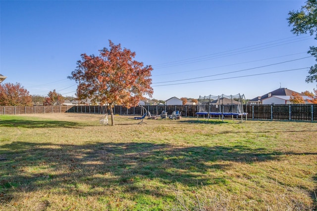 view of yard with a trampoline