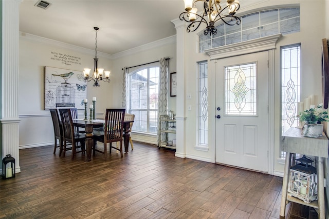 dining room featuring ornamental molding, dark hardwood / wood-style floors, and a chandelier