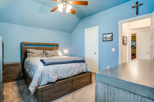 carpeted bedroom with lofted ceiling and ceiling fan