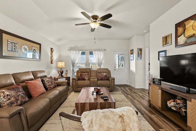 living room featuring vaulted ceiling, ceiling fan, and hardwood / wood-style floors