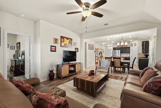 living room featuring ceiling fan and wood-type flooring