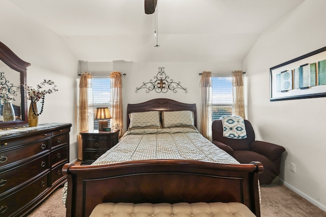 carpeted bedroom featuring lofted ceiling and ceiling fan