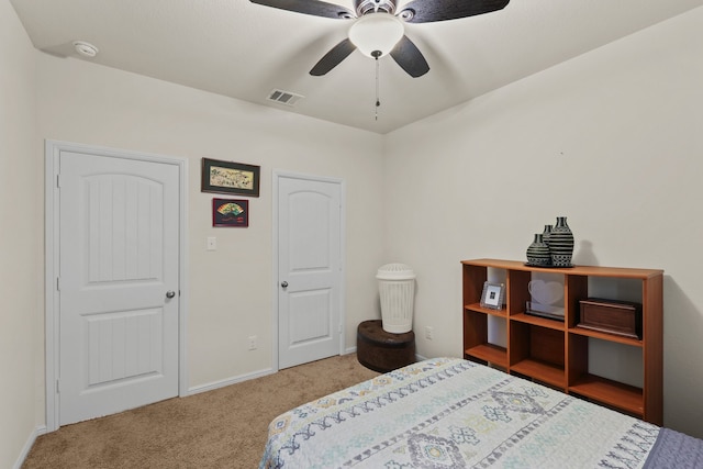 carpeted bedroom with ceiling fan