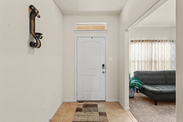 tiled entrance foyer with a wealth of natural light