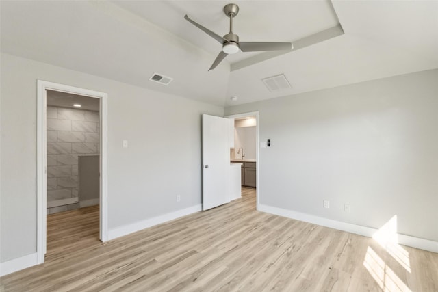 unfurnished bedroom with ceiling fan and light wood-type flooring