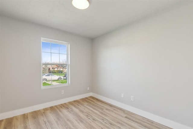 spare room featuring light hardwood / wood-style flooring