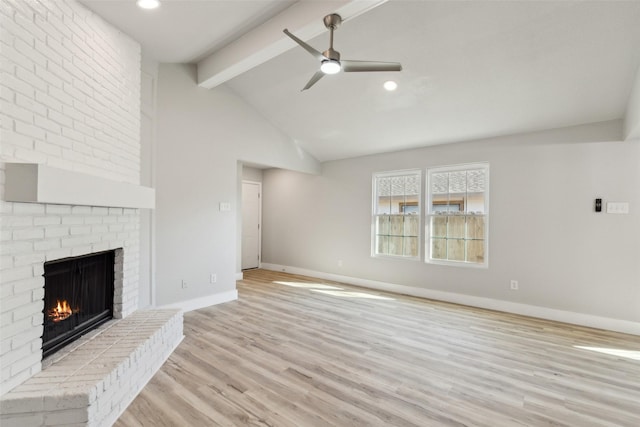 unfurnished living room with a brick fireplace, vaulted ceiling with beams, light hardwood / wood-style floors, and ceiling fan