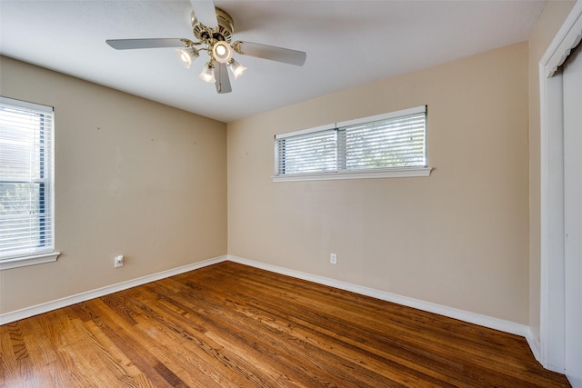 unfurnished bedroom with ceiling fan and wood-type flooring