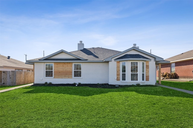 single story home with a front lawn