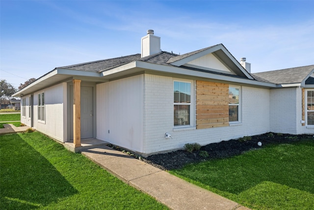 back of house featuring a yard