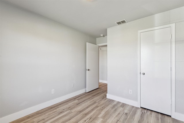 unfurnished bedroom with light hardwood / wood-style floors