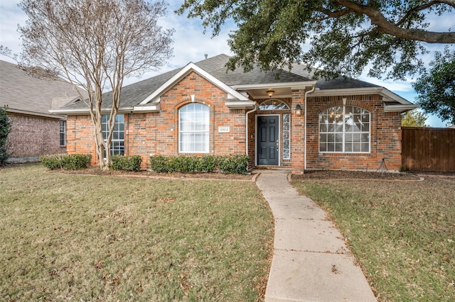 single story home with a front yard