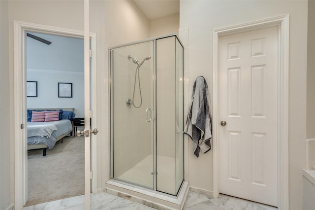 bathroom with crown molding and an enclosed shower