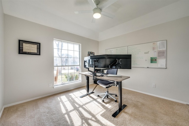 office space featuring ceiling fan, light carpet, and vaulted ceiling