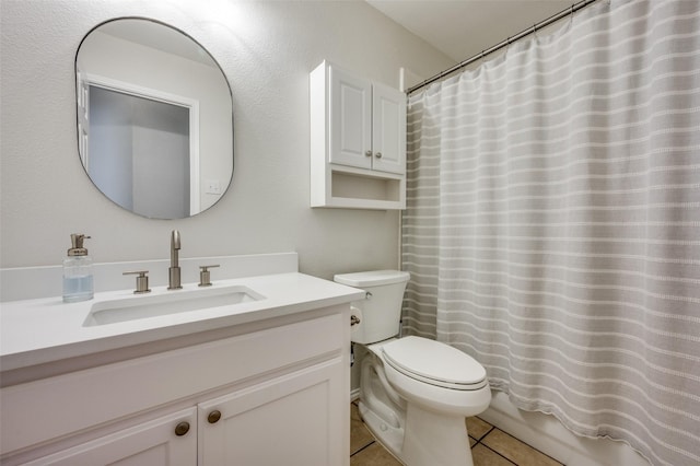 full bathroom featuring vanity, tile patterned floors, toilet, and shower / bath combo with shower curtain