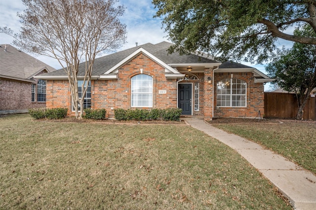 ranch-style home with a front yard