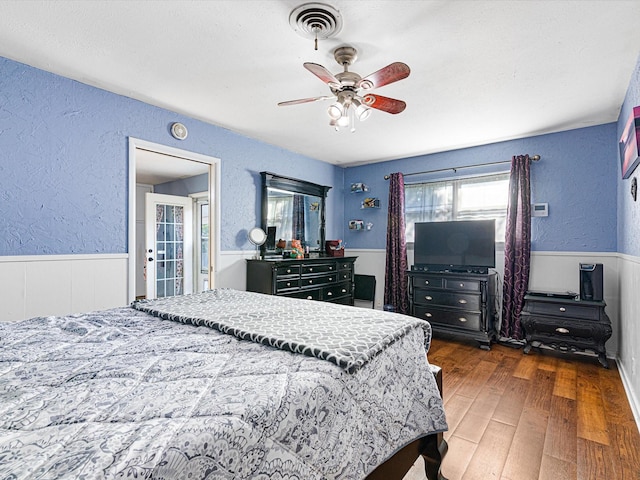 bedroom featuring dark hardwood / wood-style floors and ceiling fan