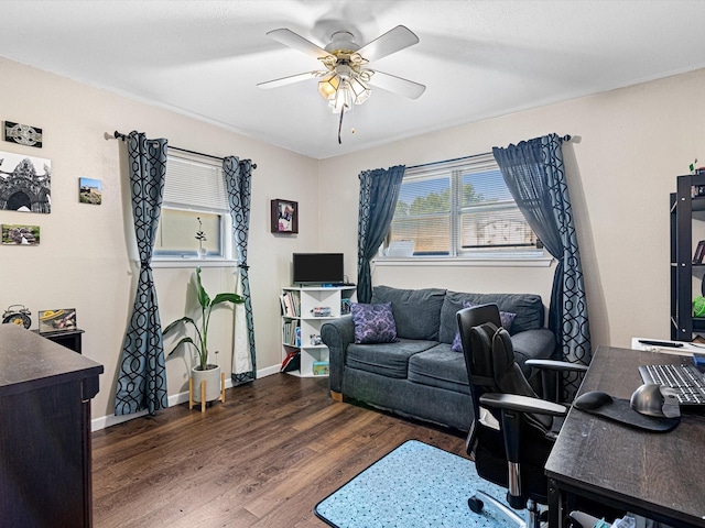 office area featuring dark hardwood / wood-style flooring and ceiling fan