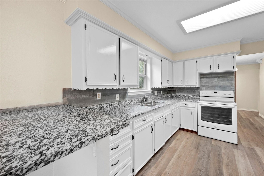 kitchen with stone counters, sink, white cabinets, white range with electric cooktop, and light wood-type flooring