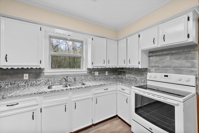 kitchen featuring light stone countertops, white cabinetry, sink, white electric range, and ornamental molding