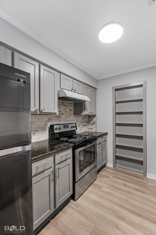 kitchen featuring gray cabinetry, stainless steel electric range oven, black fridge, dark stone counters, and ornamental molding