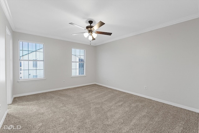 spare room with carpet flooring, crown molding, and ceiling fan