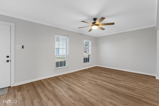 spare room with light wood-type flooring, ceiling fan, and ornamental molding