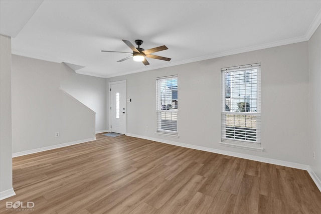 unfurnished room with light hardwood / wood-style flooring, ceiling fan, and ornamental molding