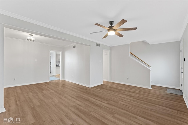 unfurnished living room featuring ceiling fan, light wood-type flooring, and crown molding