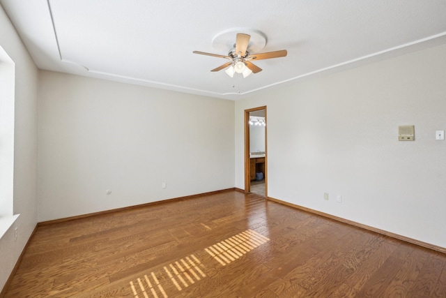 spare room featuring hardwood / wood-style flooring and ceiling fan