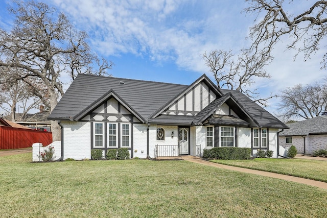 tudor-style house with a front lawn